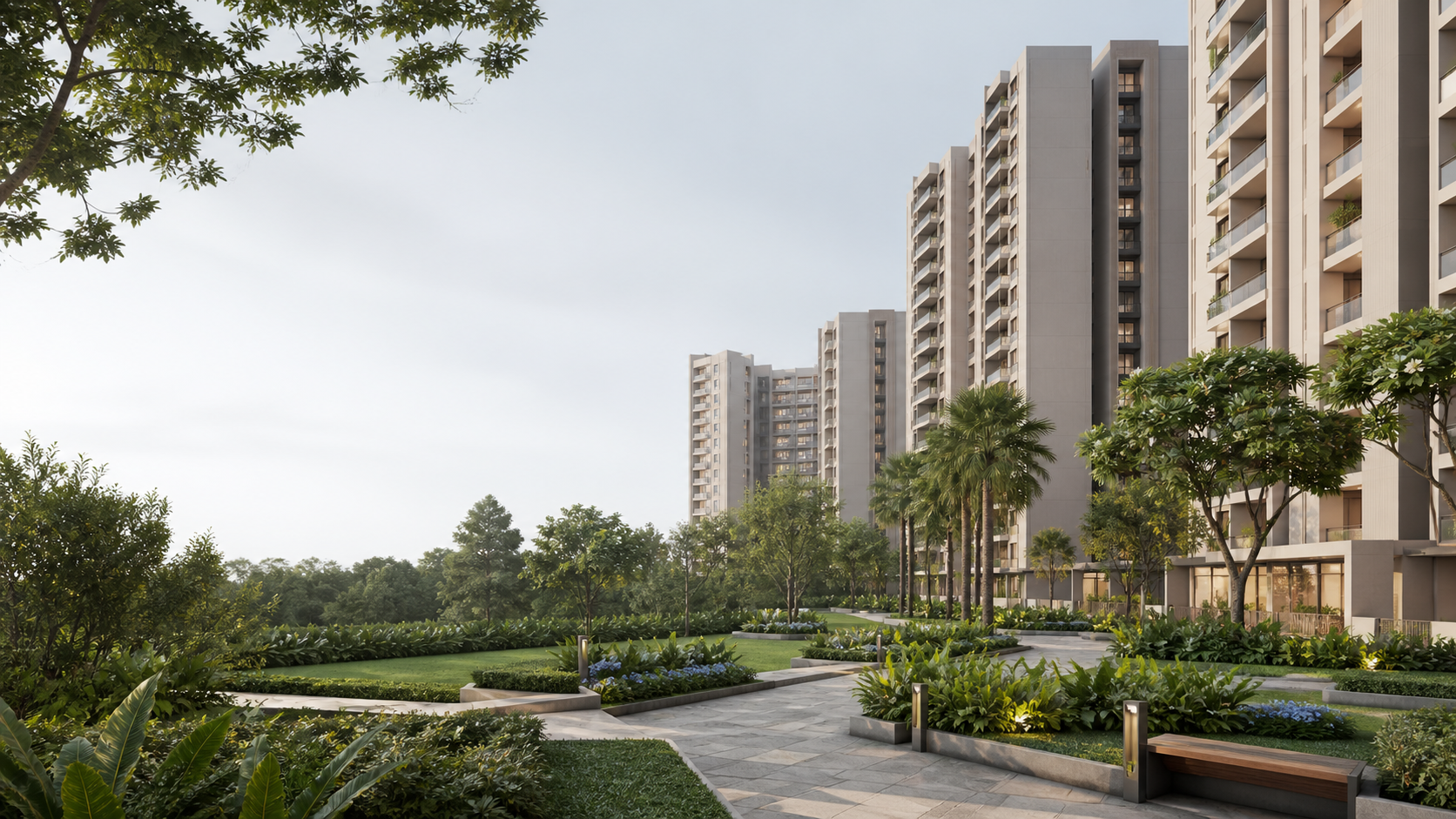 Urbanrise Begur Koppa apartment buildings beside a landscaped pedestrian garden