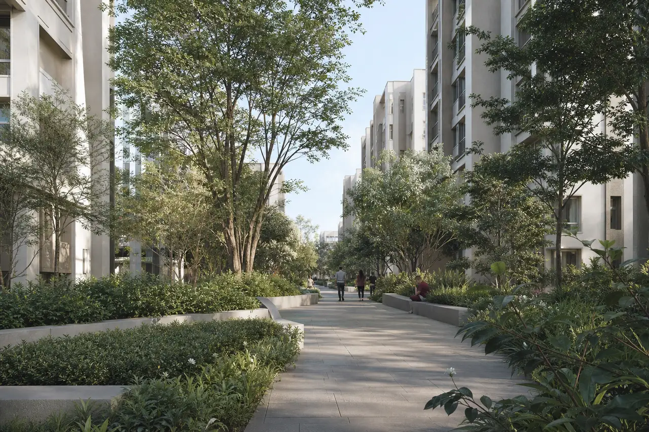 Shaded pedestrian garden between contemporary light-coloured apartment buildings